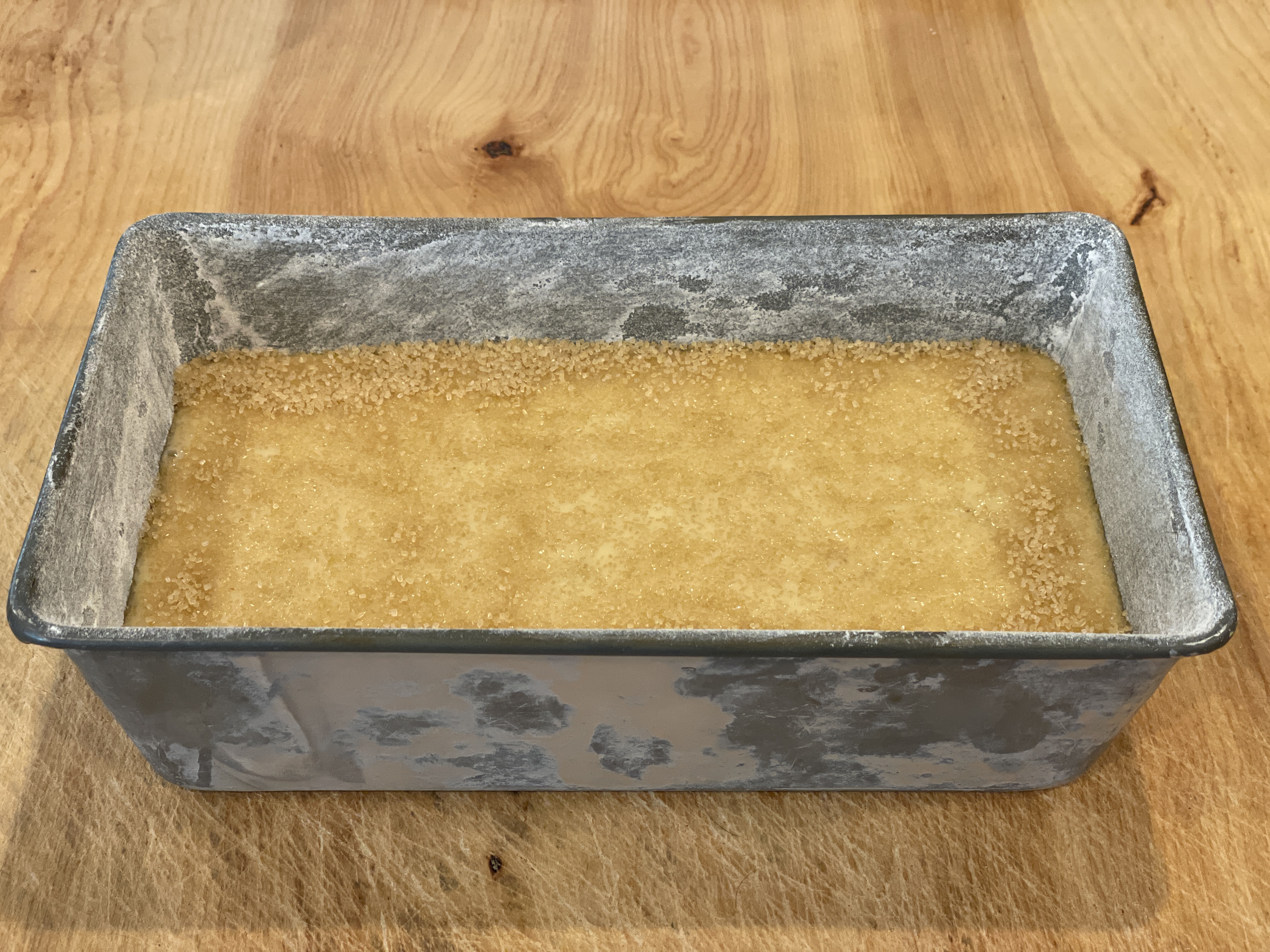 Banana bread batter topped with sugar before baking